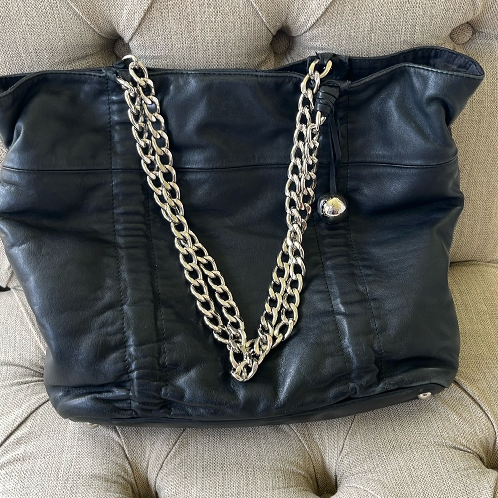 Black leather Furla handbag with silver hardware.